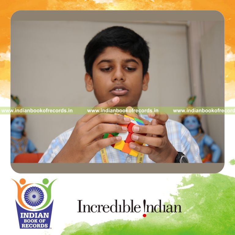 young male solving rubiks cube repeatedly within three hours for record in Indian Book of Records