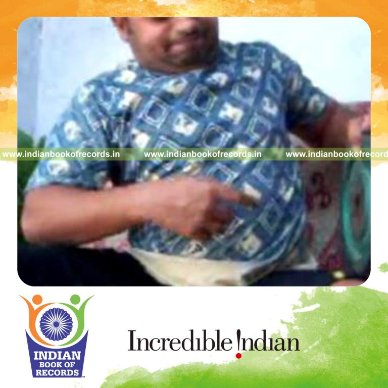 individual performing sabers rollback card cuts in one minute while holding weight plate for record in Indian Book of Records