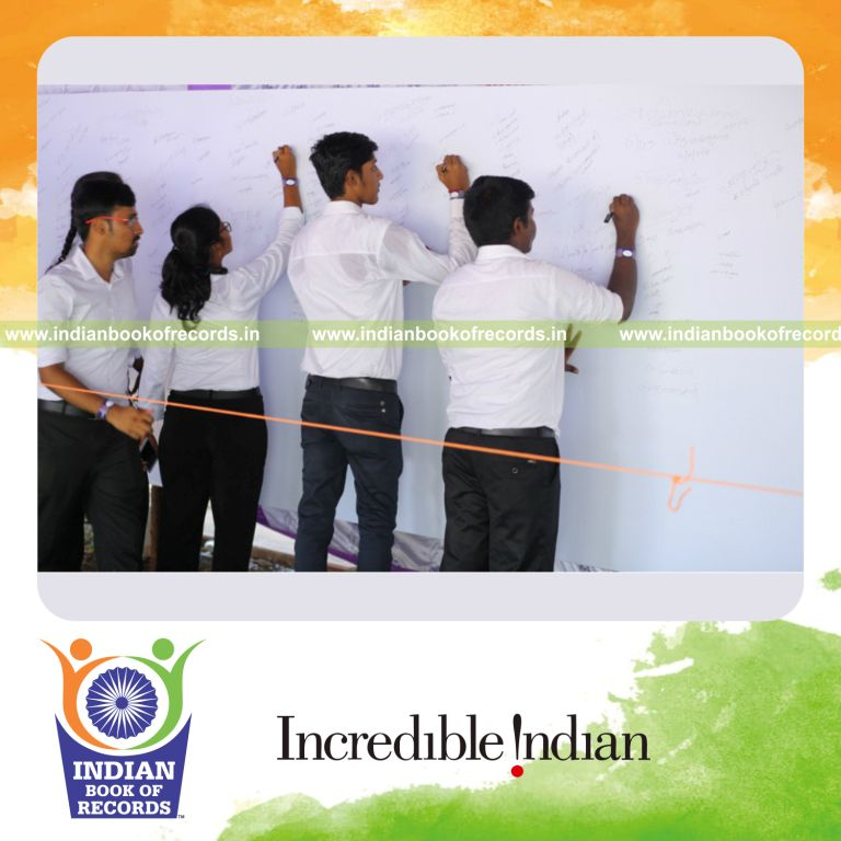 a large number of signatures written together on a whiteboard within a defined space for a record in Indian Book of Records