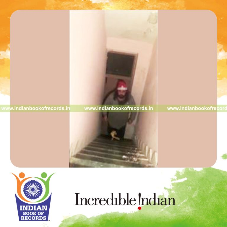 individual taking maximum steps on stairs carrying 50kg in mouth for record in Indian Book of Records