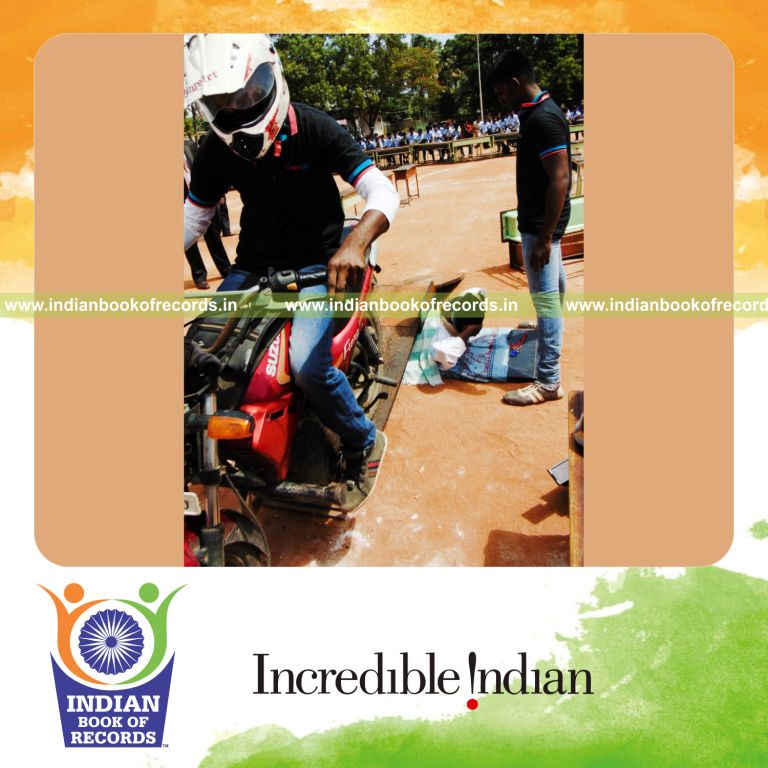 minor male performing stunt with vehicles running over stomach within 30 minutes for Indian Book of Records