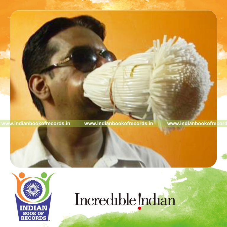 individual fitting maximum straws in mouth at once for record in Indian Book of Records