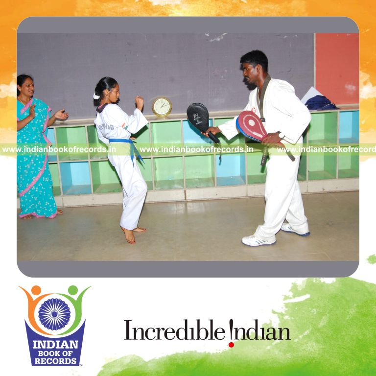 young female performing taekwondo kicks within thirty minutes for record in Indian Book of Records