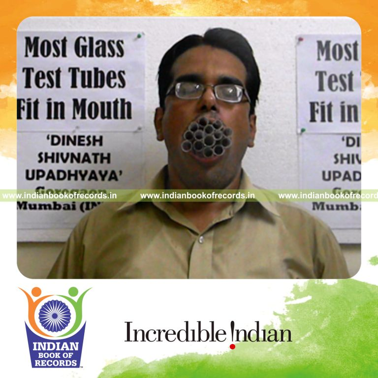 individual stuffing test tubes in mouth for Indian Book of Records