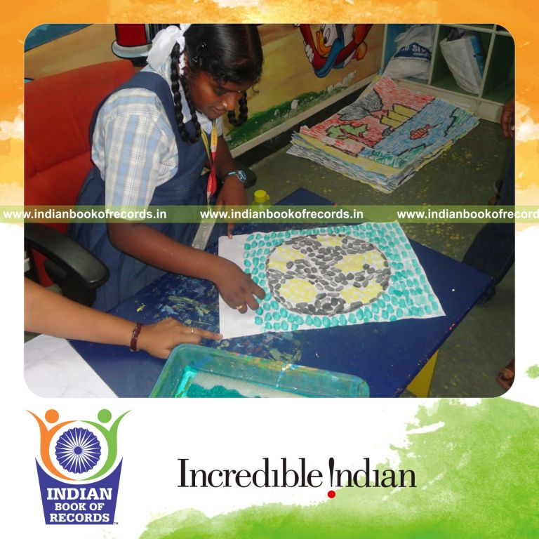 young female creating thumbprint paintings within six hours for record in Indian Book of Records