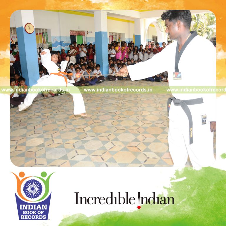 young male kicking apple off knife repeatedly within thirty minutes for record in Indian Book of Records