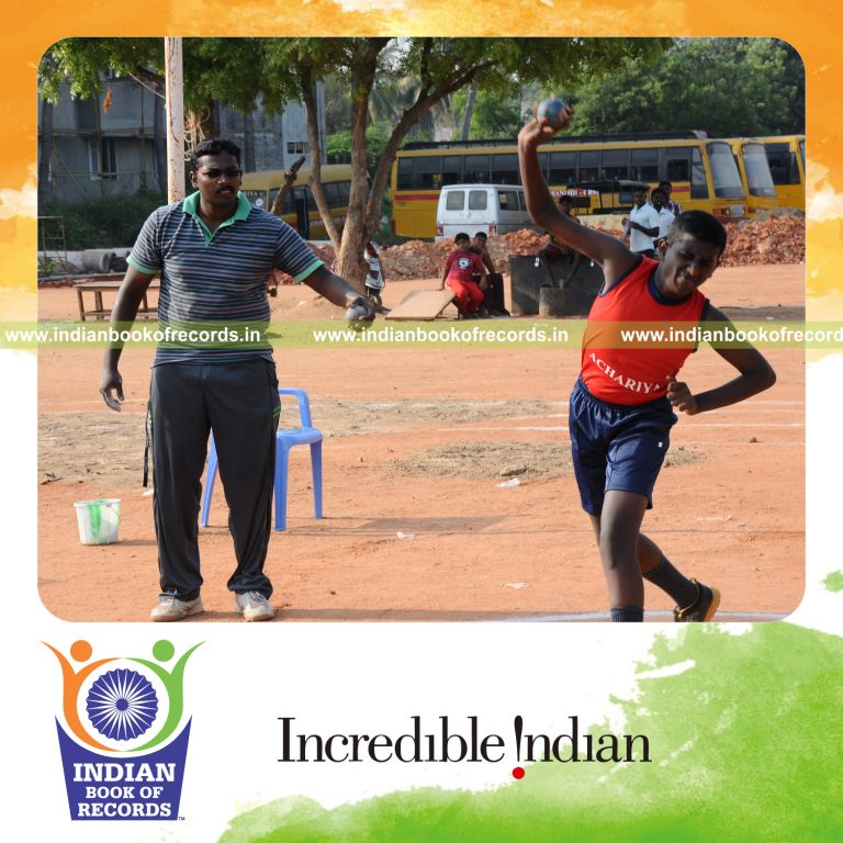 young male throwing shotput repeatedly within one hour for record in Indian Book of Records