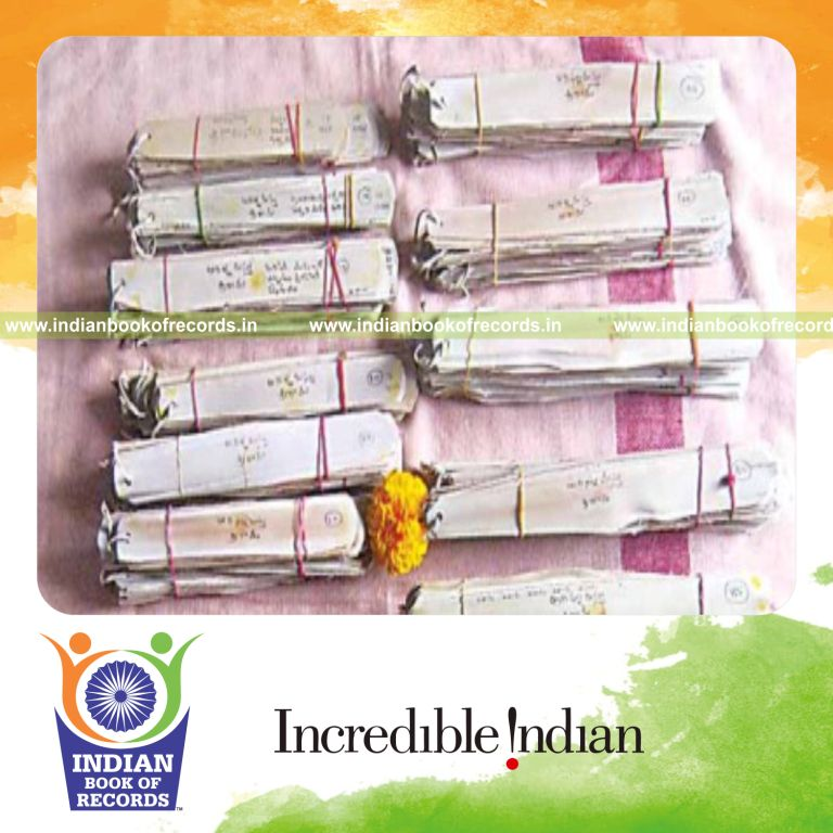 male individual writing sree rama repeatedly on palm leaves within one year for record in Indian Book of Records