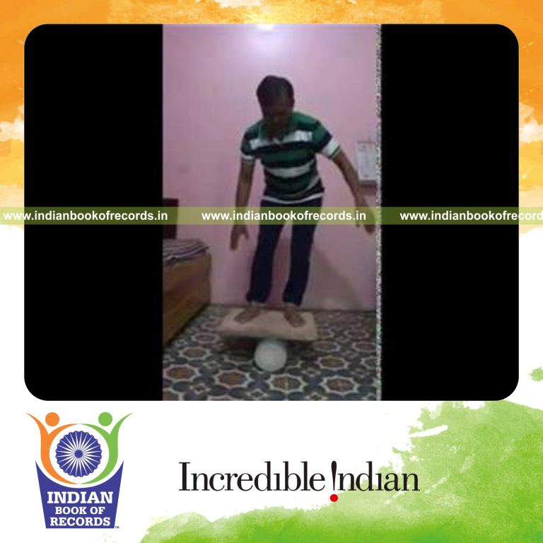 individual performing toe touches on rola bola for record in Indian Book of Records