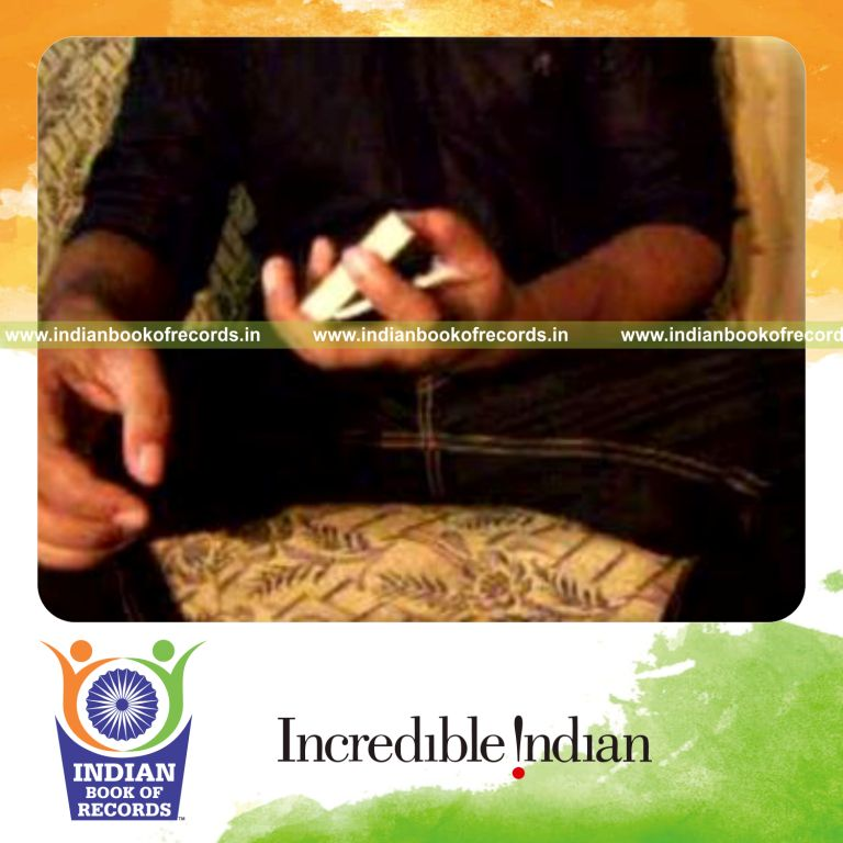 individual performing maximum consecutive triangle cuts in one minute for record in Indian Book of Records