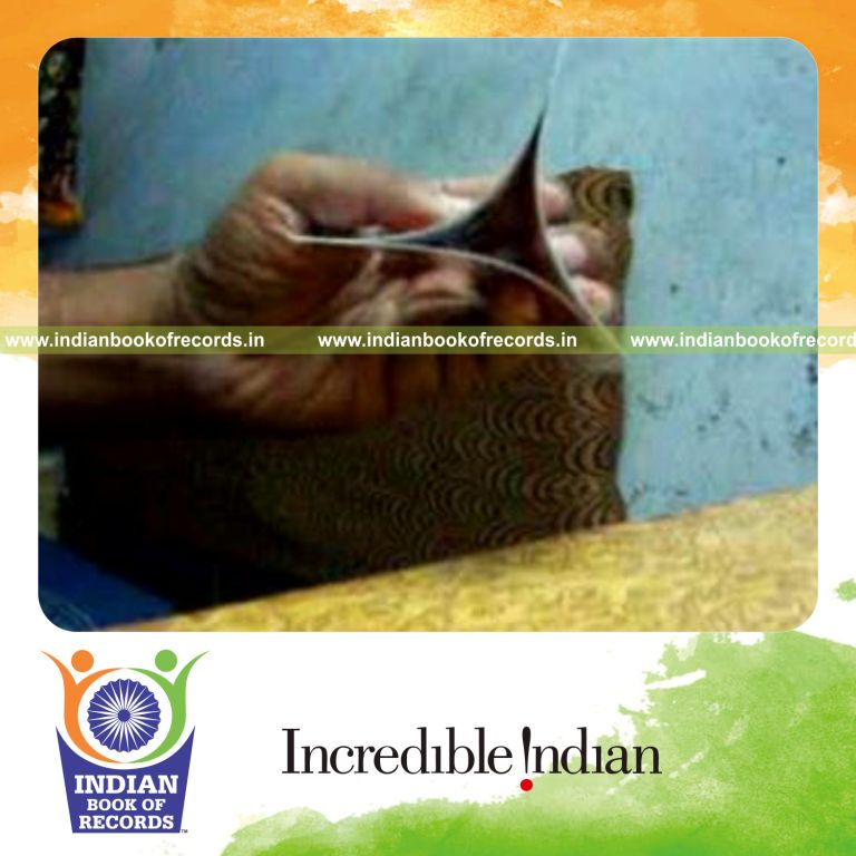 individual performing maximum triptych card displays using three cards in 30 seconds for record in Indian Book of Records