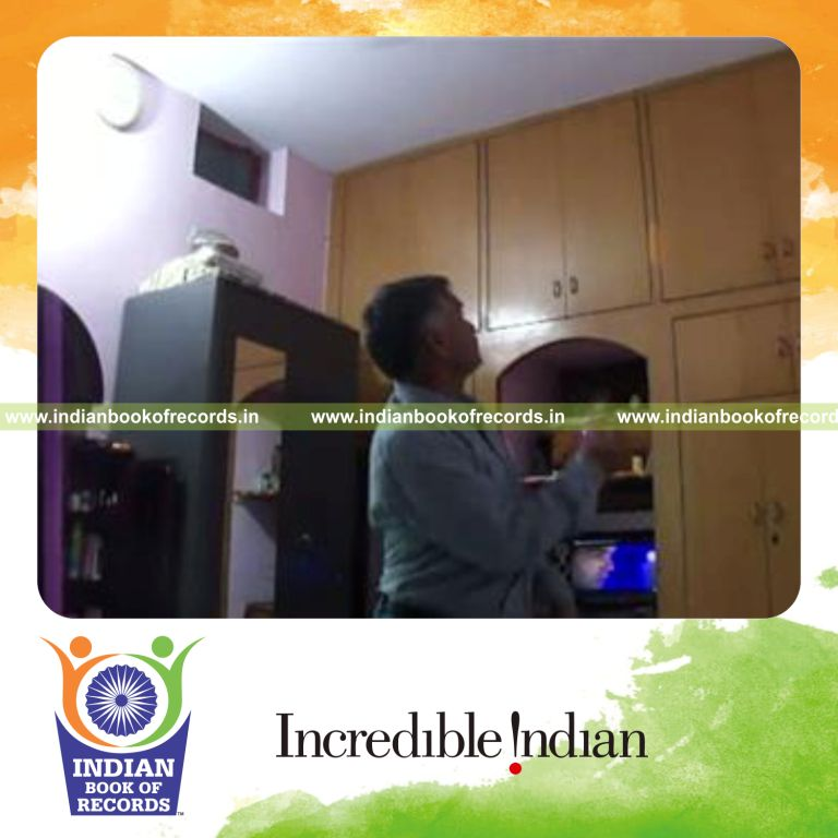 individual performing table tennis ball bounces on wall while catching sideways for record in Indian Book of Records