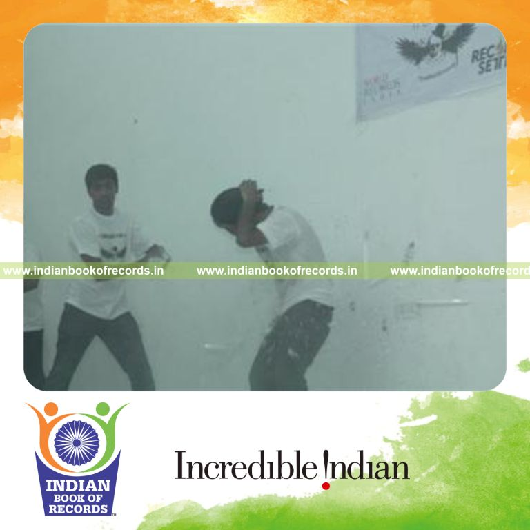 individual breaking maximum tube lights on abdomen in one minute for record in Indian Book of Records
