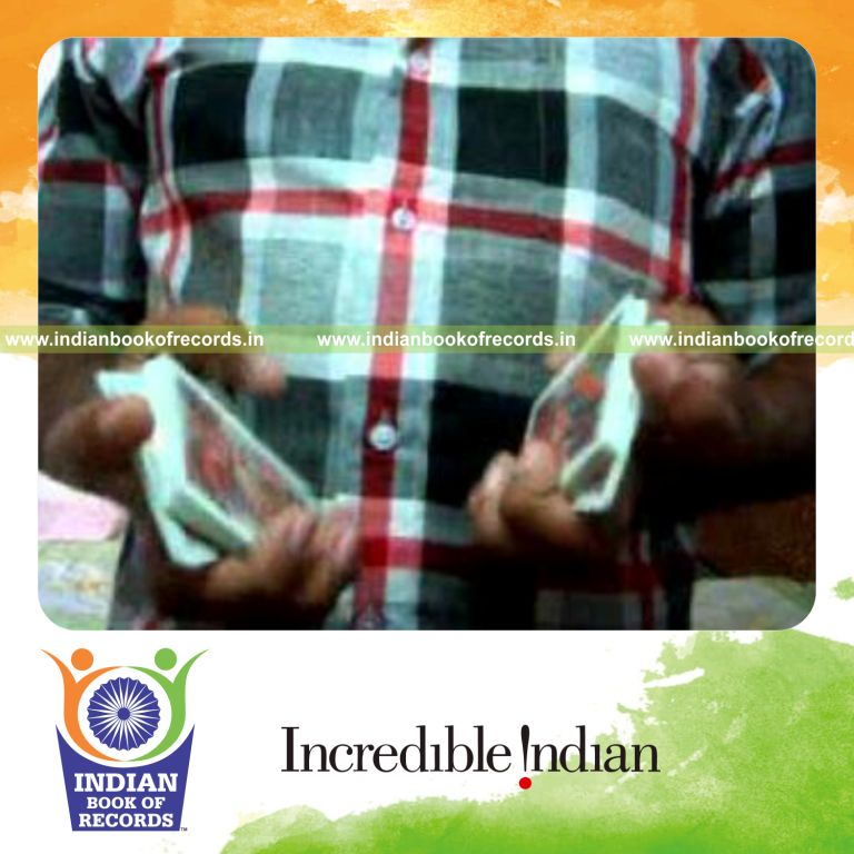 individual performing maximum two handed reverse scissor cuts in one minute for record in Indian Book of Records