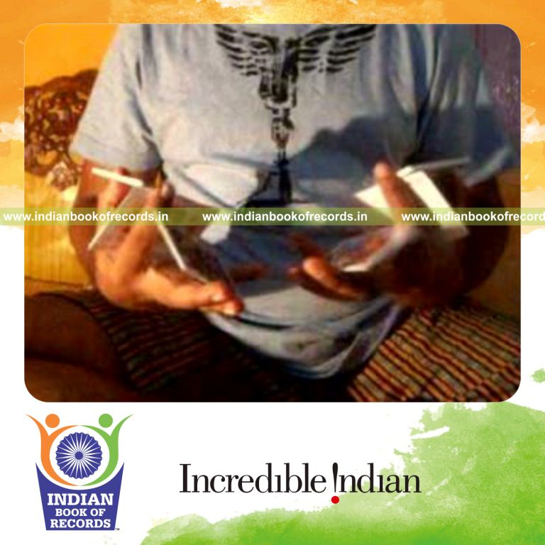 individual performing maximum two handed triangle cuts in one minute for record in Indian Book of Records