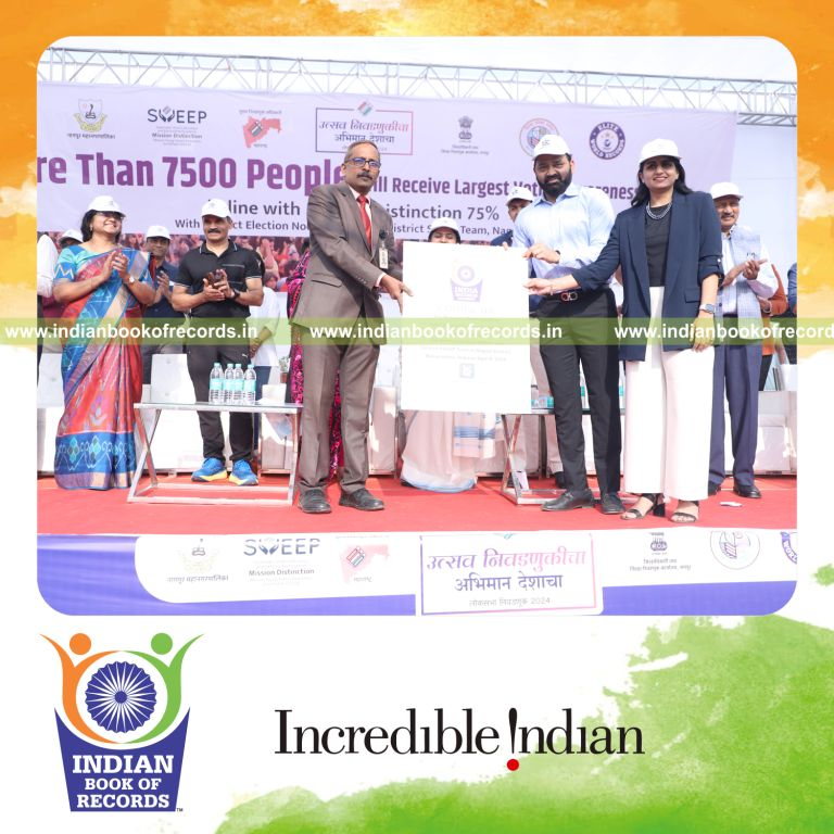 A large group gathered at a single location for a voter awareness lesson recognized by Indian Book of Records