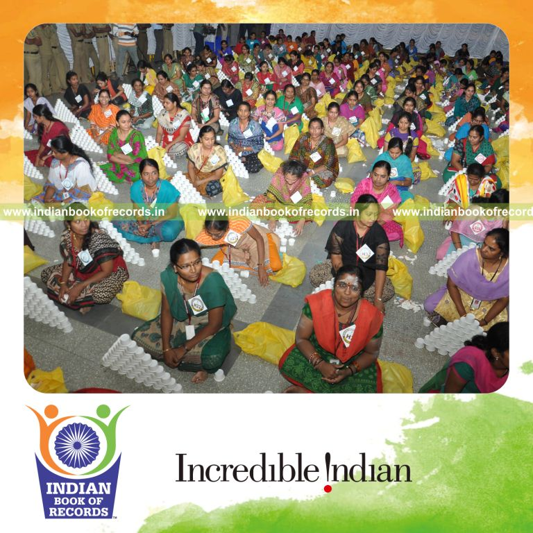 women making paper cup pyramid simultaneously for Indian Book of Records