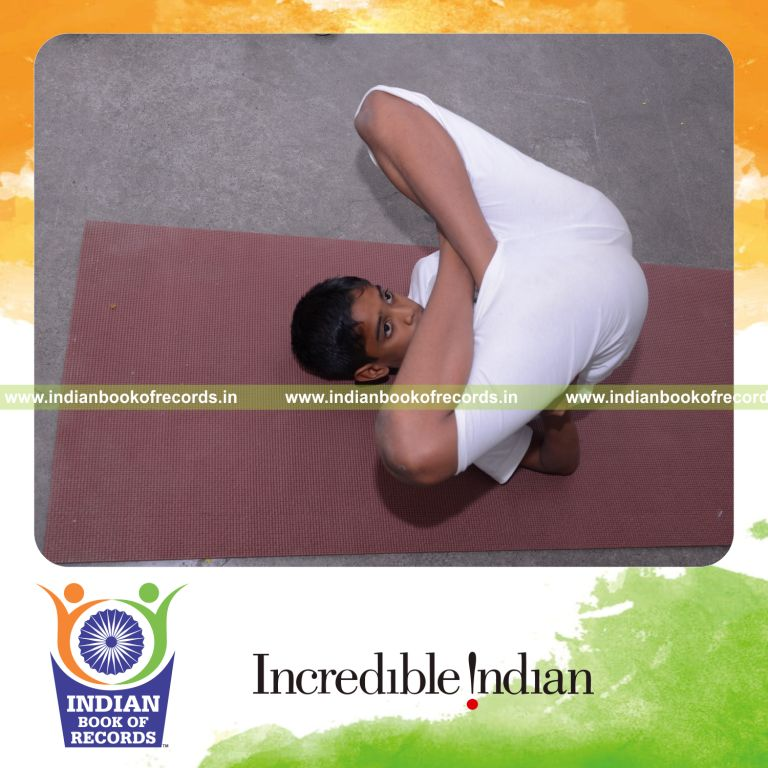 young boy performing multiple yogasanas within five hours for Indian Book of Records