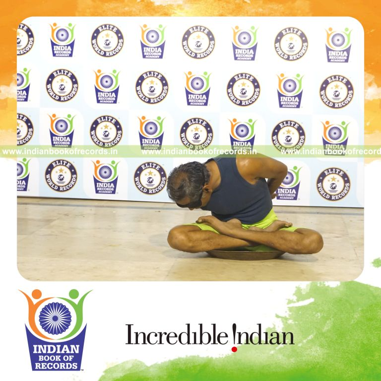 individual performing maximum yogasanas blindfolded on a brass plate in 10 minutes for record in Indian Book of Records