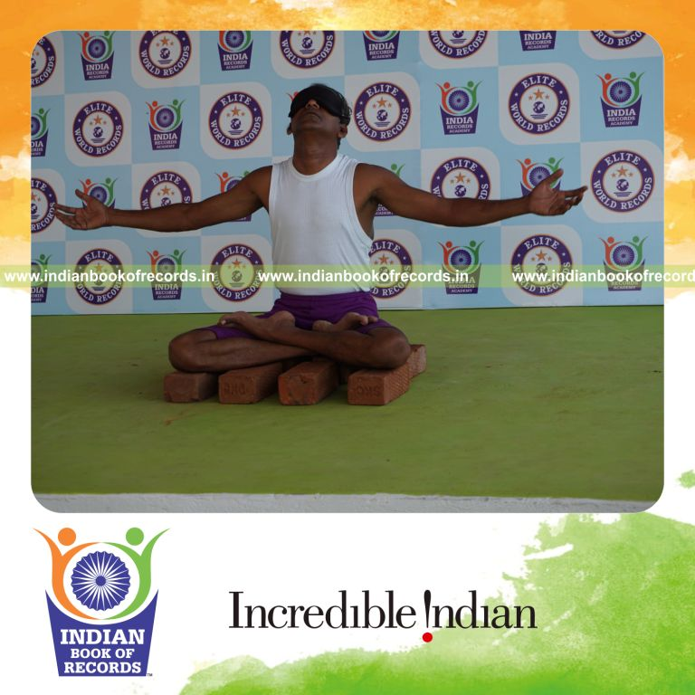 individual performing maximum yogasanas blindfolded on bricks in 5 minutes for record in Indian Book of Records