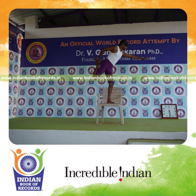 individual performing maximum yogasanas blindfolded on a chair in 5 minutes for record in Indian Book of Records
