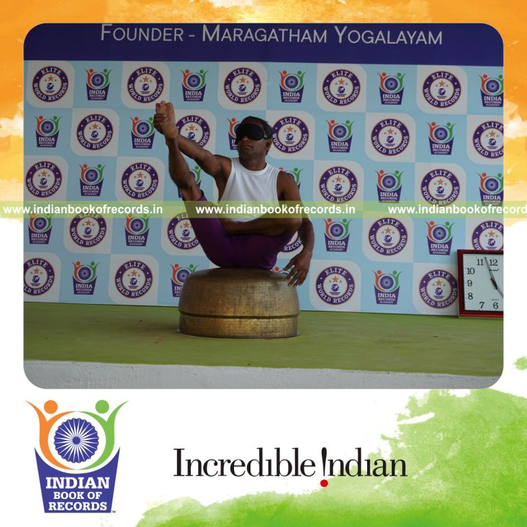 individual performing maximum yogasanas blindfolded on an inverted vessel in 5 minutes for record in Indian Book of Records