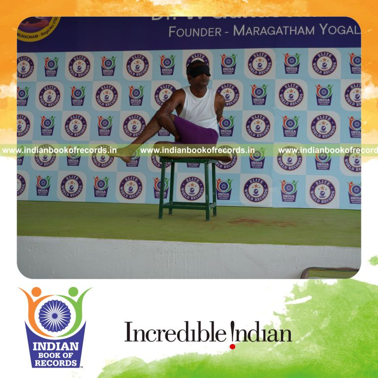 individual performing maximum yogasanas blindfolded on a stool in 5 minutes for record in Indian Book of Records