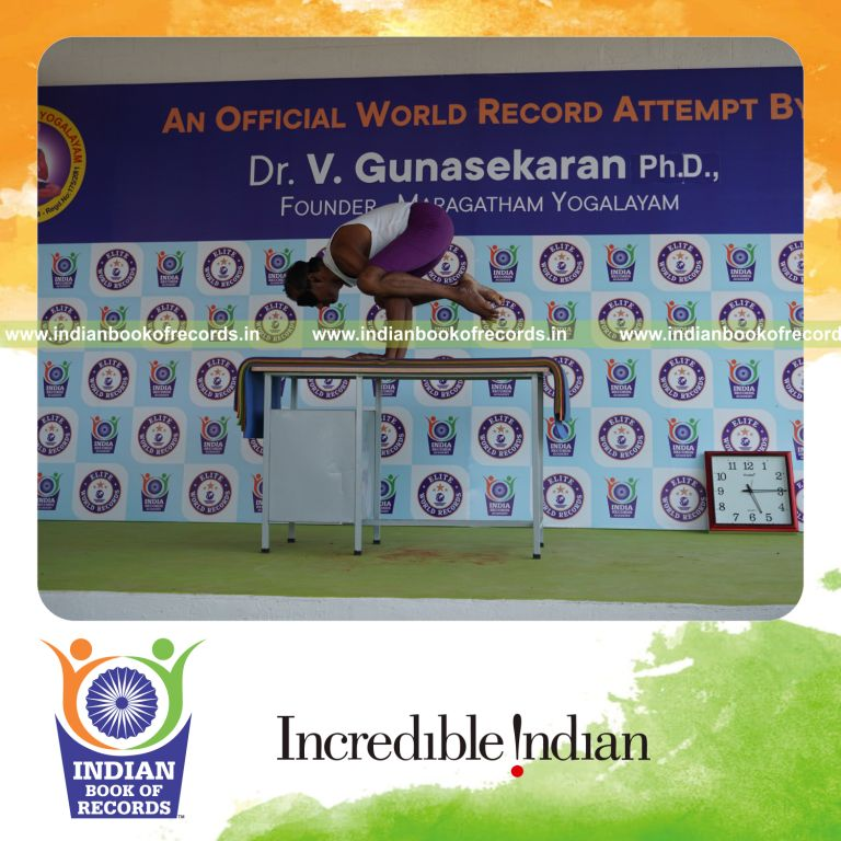 individual performing maximum yogasanas blindfolded on a table in 5 minutes for record in Indian Book of Records