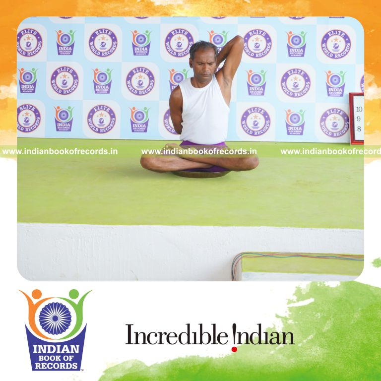 individual performing maximum yogasanas on a brass plate in 5 minutes for record in Indian Book of Records
