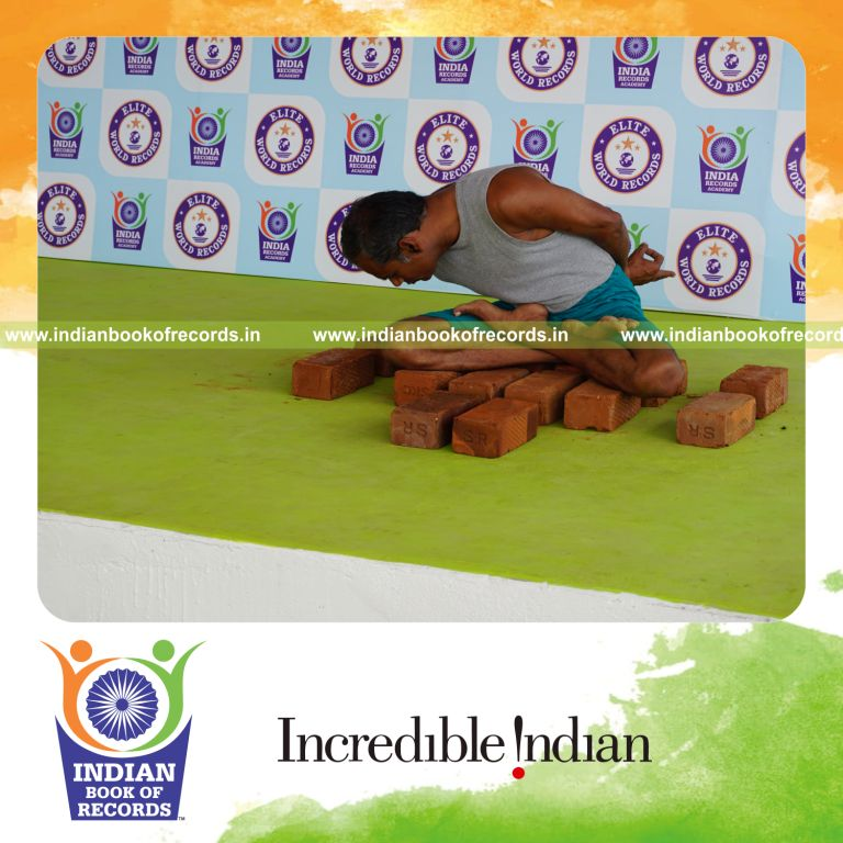 individual performing maximum yogasanas on bricks in 10 minutes for record in Indian Book of Records
