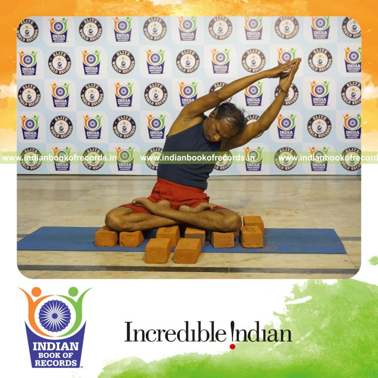 individual performing maximum yogasanas on bricks in 15 minutes for record in Indian Book of Records