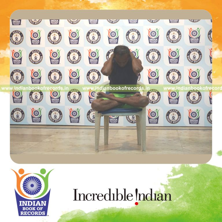 individual performing maximum yogasanas on a chair in 10 minutes for record in Indian Book of Records