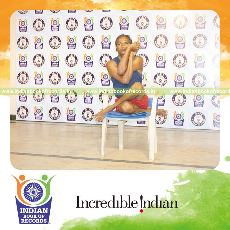 individual performing maximum yogasanas on a chair in 15 minutes for record in Indian Book of Records