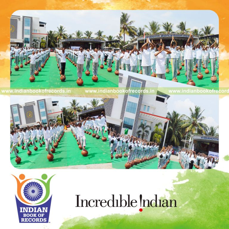 participants performing yogasanas on inverted mud pots simultaneously at single venue for Indian Book of Records