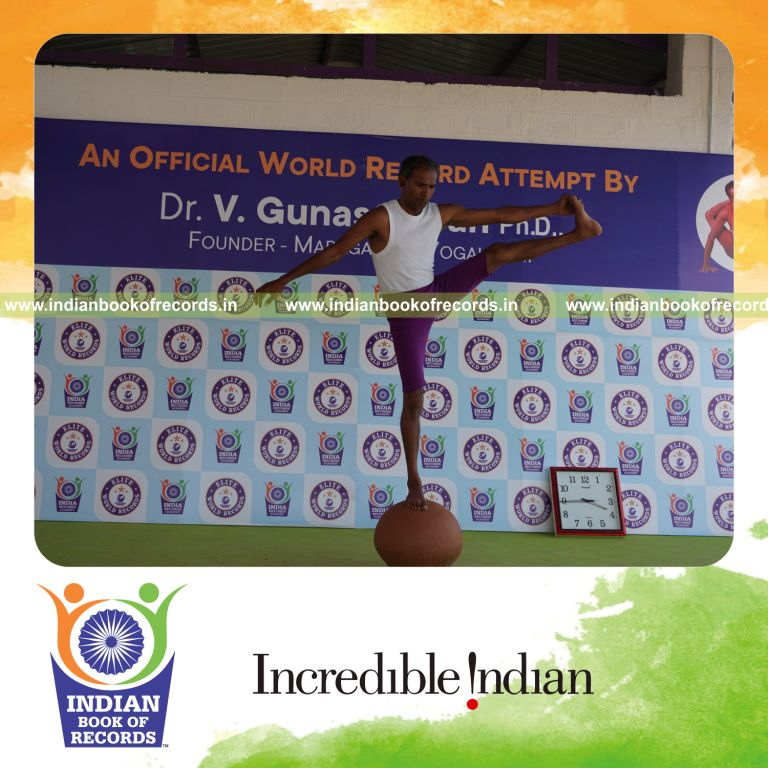 individual performing maximum yogasanas on an inverted pot in 5 minutes for record in Indian Book of Records