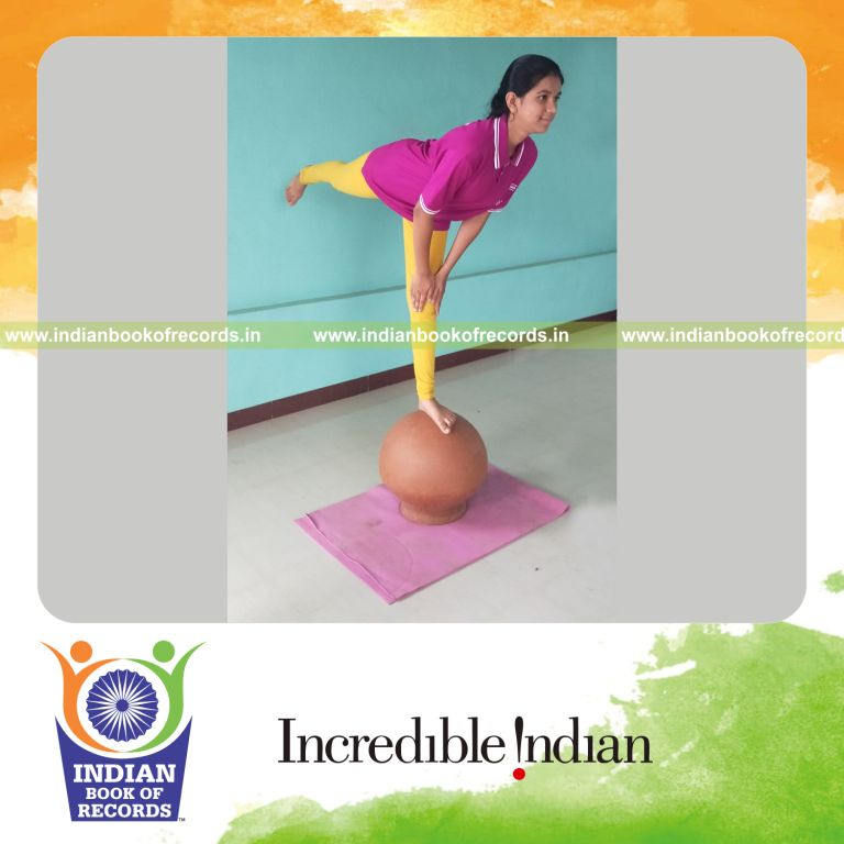 individual minor female performing maximum yogasanas on an inverted pot in 10 minutes for record in Indian Book of Records