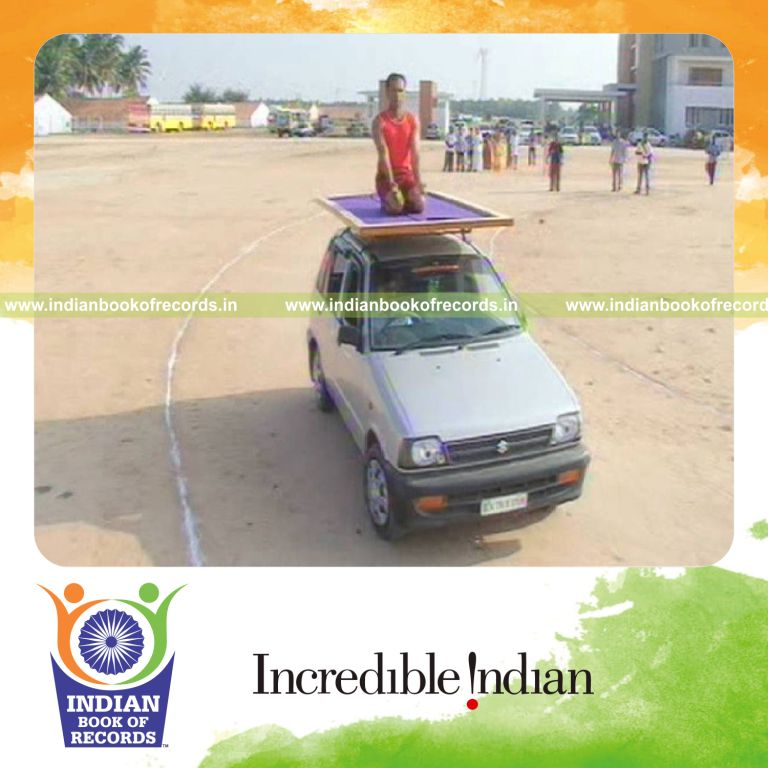 male performing yogasanas on moving vehicle for Indian Book of Records