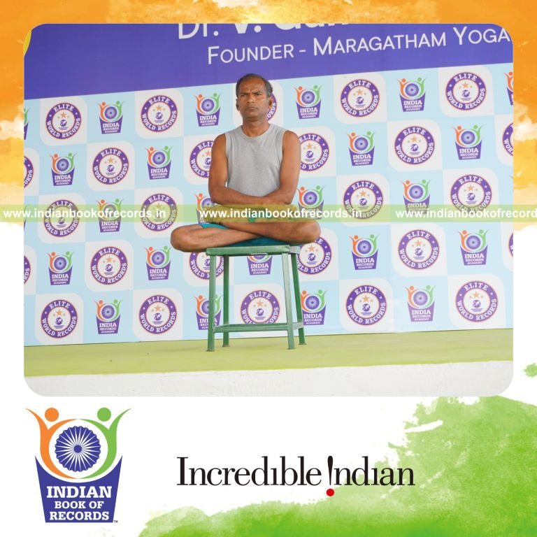 individual performing maximum yogasanas on a stool in 10 minutes for record in Indian Book of Records