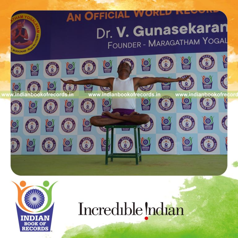 individual performing maximum yogasanas on a stool in 5 minutes for record in Indian Book of Records
