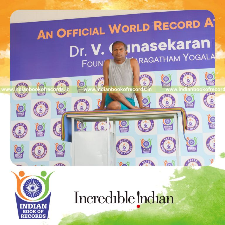 individual performing maximum yogasanas on a table in 10 minutes for record in Indian Book of Records