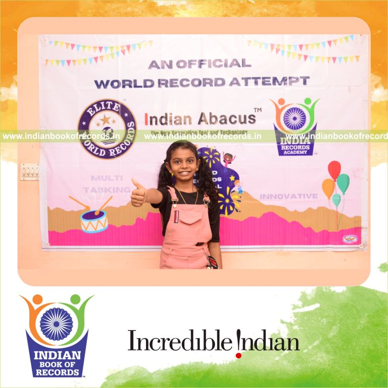 A participant completing multiple addition problems across three rows within twelve minutes for the Indian Book of Records
