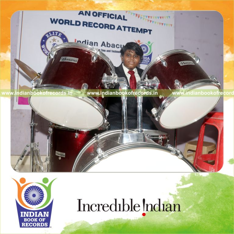 A participant solving arithmetic problems while simultaneously playing drums recognized by Indian Book of Records