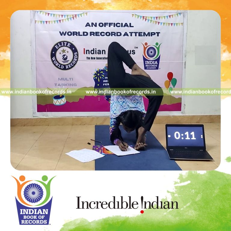 A participant solving multiplication problems while performing yoga simultaneously for the Indian Book of Records