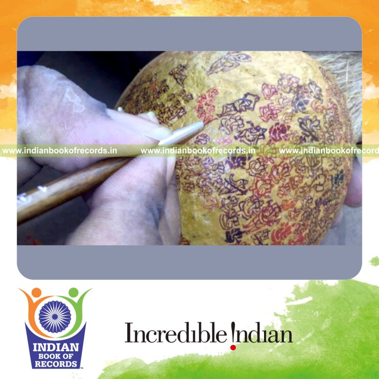 micro ganesha paintings on coconut by individual male for Indian Book of Records