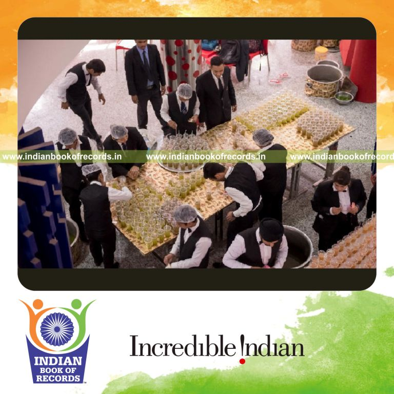 large gathering participating in a non alcoholic cocktail tasting event for Indian Book of Records