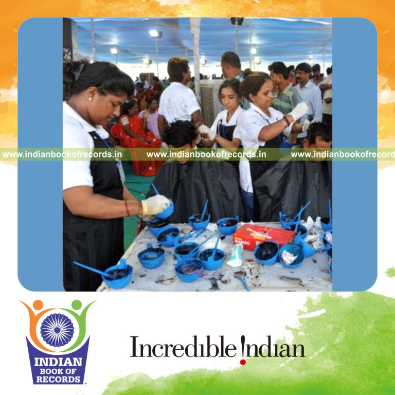 person colouring multiple heads within 12 hours for record in Indian Book of Records