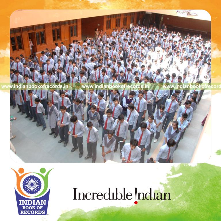 group of people reading simultaneously at a single venue for record in Indian Book of Records