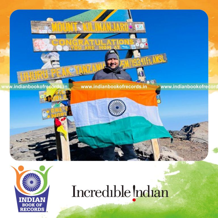 Individual performing hanging sit-ups on a bar at Mount Kilimanjaro recognized by Indian Book of Records