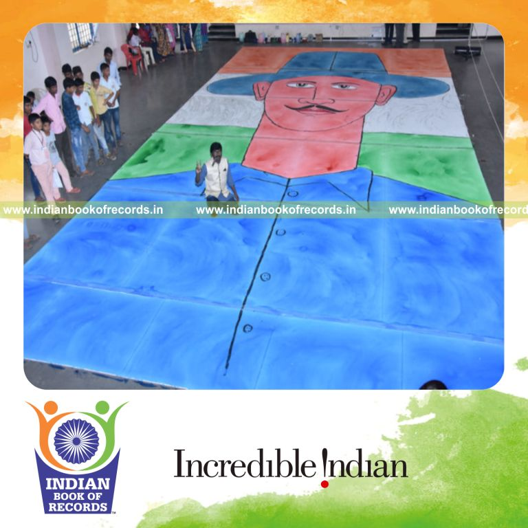 individual creating a large painting using mouth techniques as part of a record achievement for Indian Book of Records