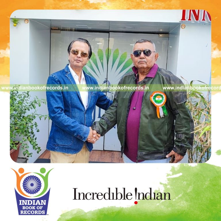 Elderly rider completing a long spiritual motorcycle expedition recognized by Indian Book of Records